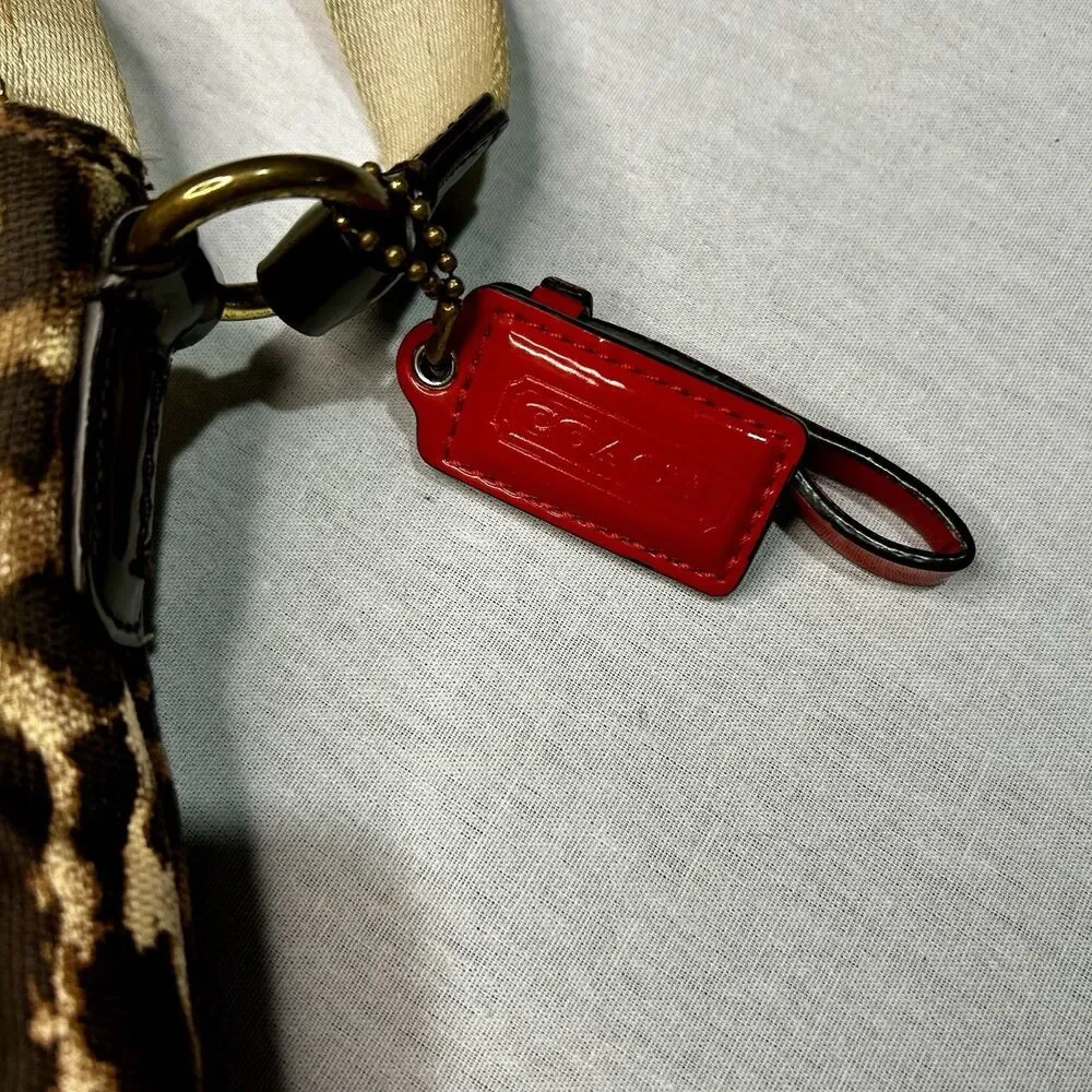 Coach Vintage Ocelot Swingpack crossbody bag with a leopard print exterior
